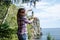 Forced perspective view of a pretty female appearing to hold light house