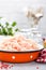 Forcemeat. Raw ground chicken meat in bowl on white kitchen table. Fresh minced chicken breast meat