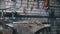 A forceps and a hammer laying on the anvil. Blacksmith workroom.