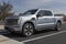 Ford F-150 Lightning display. Ford offers the F150 Lightning all-electric truck in Pro, XLT, Lariat, and Platinum models