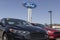 Ford Fusion display at a dealership. Ford sells traditional gasoline, electric and hybrid SUV models