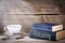 Forecasting and Reports. Stack of books on wooden desk