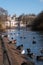 In the foreground, birds and waterfowl on and by the lake in St James`s Park, London UK. In the background, Horse Guards