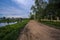 Foreground of a country road and in the distance the visible city of Torzhok, Russia