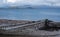 In foreground, ruins of small boat on the beach at Polbain, north of Ullapool. In background, view of the Summer Isles, Scotland