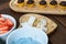 In the foreground: strawberries and butter cream defocused. Pistachio turron next to brigadiers Brazilian sweet.