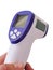 Forehead thermometer isolated  holding  in man `s hand