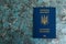 Foreign passport of a Ukrainian on a dark background with copy space. The concept of Ukrainians going abroad to earn