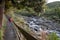 Foreign tourist visiting Wilkies Pools trail, Mount Egmont in New Zealand