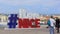 Foreign tourists making photos near big memorial inscription about love to Nice