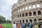 Foreign tourists on trips walk photographed and consider the main historical sites in the Italian capital Rome, the ruins of the C