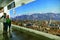 Foreigner tourists family looking at huge panoramic billboard of city view