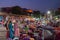 Foreigners buying Rajasthani womens clothes being sold at Famous Sardar Market and Ghanta ghar Clock tower in the evening