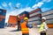 Foreman and Businessman control loading Containers