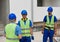 The foreman on the construction site gives instructions to the workers