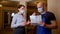 Foreman construction worker in a medical face mask shake hands to woman