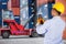 Foreman control forklift handling the container box