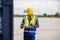Foreman dock worker in hardhat and safety vest checking containers box from cargo, Engineer man checking and inspect the