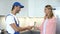 Foreman shaking hand with happy client, home repair and maintenance services