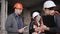 The foreman and two women inspectors visiting the construction site.