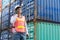 Foreman using smartphone at Cargo container shipping