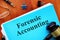 Forensic accounting is shown on the business photo using the text