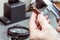 A forensic service officer measures the cartridge case from a firearm with a caliper and conducts a ballistic examination. Close-u