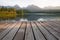 Forest Alpine mountain lake and wooden board
