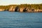 Forest and Cliffs with Caves at Lakeshore