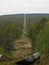Forest corridor building the Three-Country Cairn on the border between Russia, Norway and Finland