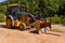 Forest County, Pennsylvania, USA 7/15/20 Heavy construction equipment idle along a road