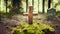 Forest dig cemetery, funeral background - Wooden cross on moss.