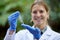 Forest, ecology and woman scientist test rock for research or inspection of the ecosystem and environment study. Science