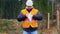 Forest engineer burning sensitive documents in the forest