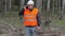 Forest engineer with cell phone in woods