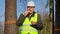 Forest engineer eating potato chips in the forest