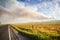 Forest fire over wheat field and highway