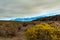 Forest fire smoke sky above desert valley and mountain range