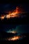 Forest fires in the night. AI generated