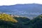 Forest on high hills, Calolziocorte and Garlate lake, Rossino castle in early evening in spring.