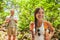 Forest hiker young hikers tourist walking in outdoor nature in Hawaii. Summer outdoor active lifestyle trek in Hawaii. Young Asian