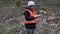 Forest inspector using tablet PC at cleared forest