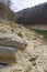 Forest lake shore in Tennessee, layered stones on the shore