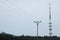 Forest landscape with radio tower and overhead powerline