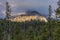 The forest and a mountain peak.