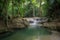 forest oasis with rushing waterfall and peaceful pool