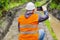 Forest officer filmed with tablet PC rutted forest road