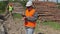 Forest officers near to lumber pile