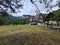 Forest path and guesthouse towards Ialomicioarei cave. Valea Horoabei, Romania mountains