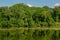 Forest reflecting in the water of Comelles lake, Orry-la-Ville , Oise, France